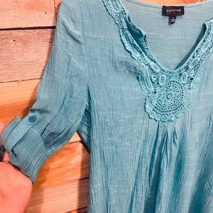 Lightweight turquoise blouse with crochet detail